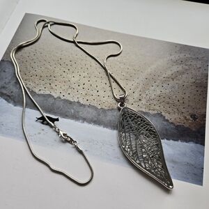 Elegant Silver Leaf Pendant Necklace On The Long Chane With Cryatals Inside